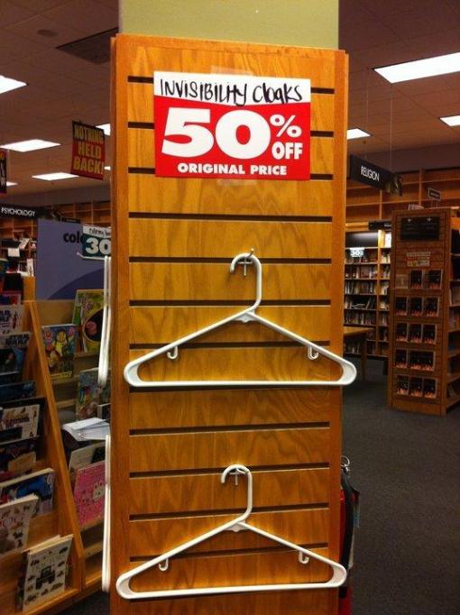 Closing Borders displays empty hangers with the sign "Invisibility Cloaks: 50 Percent Off"